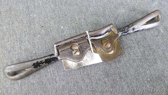 Antique combination spoke shave has a straight blade and a curved blade measure approx.. 10" long.