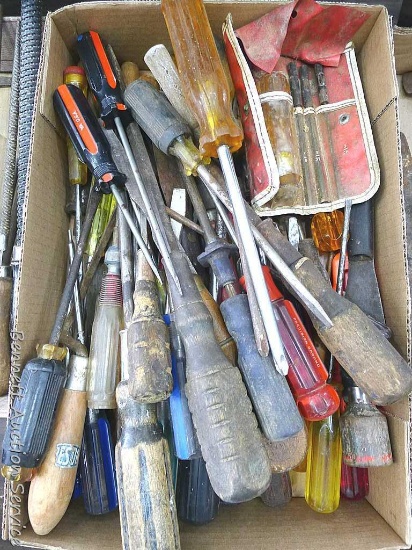Assortment of screw drivers, putty knives, and more. Longest screw driver measures approx.. 14"