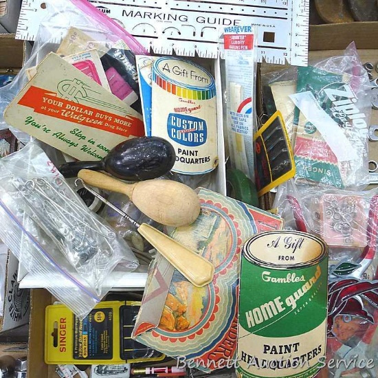 Darning eggs, button hook, curved and straight needles, sewing machine feet, metal bobbins, snaps,