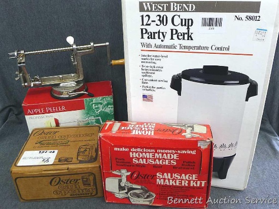 Apple peeler, several pieces of Oster sausage maker kit, Oster can opener, and West Bend 30 cup