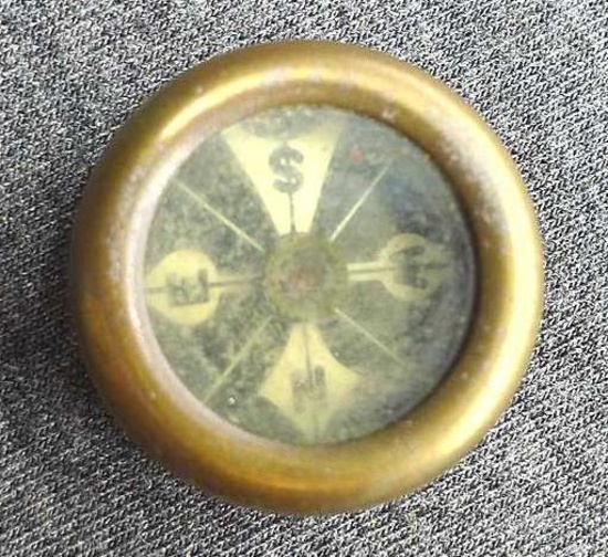 Marble's, Gladstone Mich USA compass, looks to be made of brass; measures 1" in diameter.