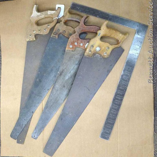 Four hand saws and square. Saws have some rust on blades and chips on handles. Longest saw measures