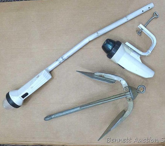 Boat lights and anchor. Anchor measures approx.. 15" x 10". Longest boat light measures approx.. 27"