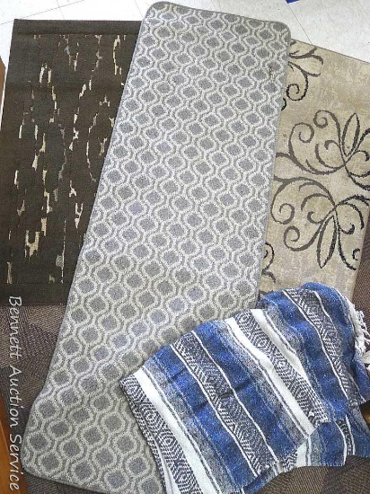 Three area and entry rugs plus throw. Largest rug measures approx.. 45" x 30". throw measure