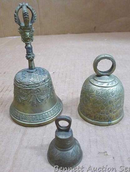 Three cast brass bells up to about 6" tall.