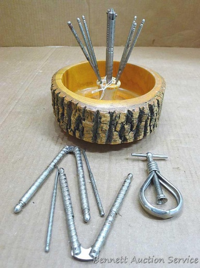 Neat wooden nut dish and a slew of picks and nut crackers. Dish about 8" wide, neat piece.