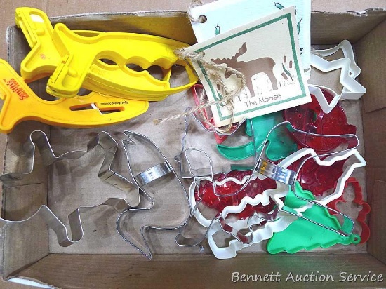 Gingerbread man, Minnesota, loon, moose, and other cookie cutters, plus a few knife or scissors