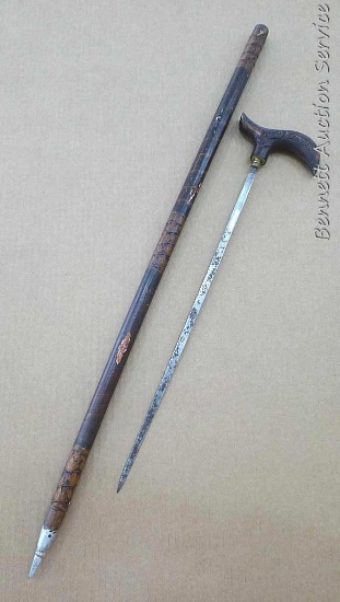 Unique sword cane with carved accents is about 34" long. Sword part is about 22" long overall. Small
