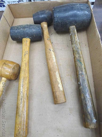 Three rubber mallets and a wooden mallet or gavel. Largest is 14" with a 4-1/2" head.