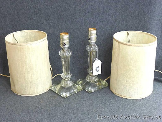 Pair of glass based dresser lamps stand about 20" tall with shades put on. Cute pieces.