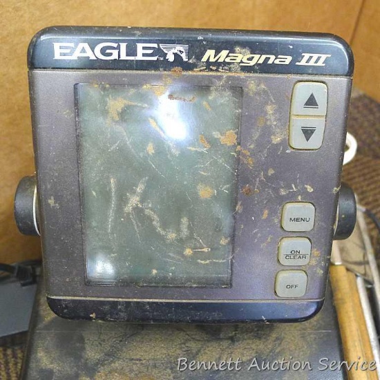 Eagle Magna III fish or depth finder, plus some cords. Measures about 12" x 8" x 9" overall.