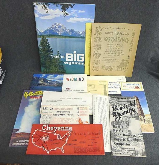 Vintage maps, pamphlets, and papers promoting vacationing in Wyoming. Includes a 1959 directory of