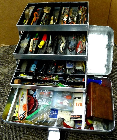 Umco fishing tackle box with lures, hooks, bobbers, jig heads, fishing line, more. Lures include a