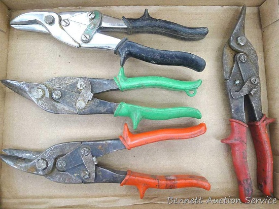 Three pairs of Wiss aviation shears and one Craftsman pair. All about 10" long.