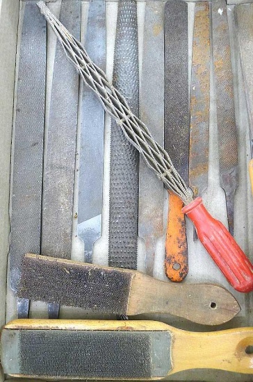 Files and rasps, plus a couple file cards. Red handled piece is 14" long.
