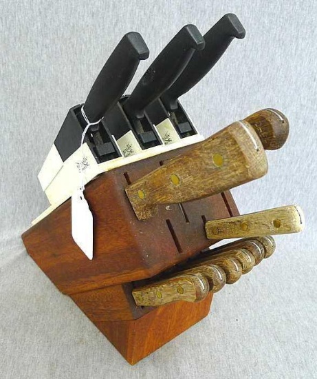 Set of knives in a nice wooden block include chefs knife, steak knives, paring knife, more up to