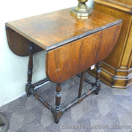 Beautiful drop leaf table is in good condition. Top is 30" wide and about 18" with leaves down,