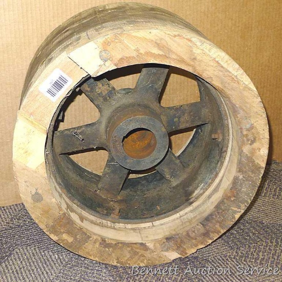 Wooden flat belt pulley is about 16" x 10". Mount hole about 2-1/4" wide.