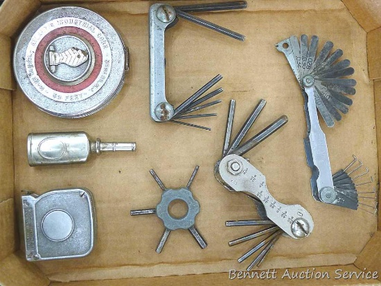 Craftsman and other feeler gauges, hex wrench sets, measuring tapes, plus a 3" miniature oil bottle.