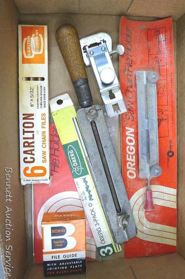 Assortment of chain saw files and file guides. Boxes contain one file each file guides are in good