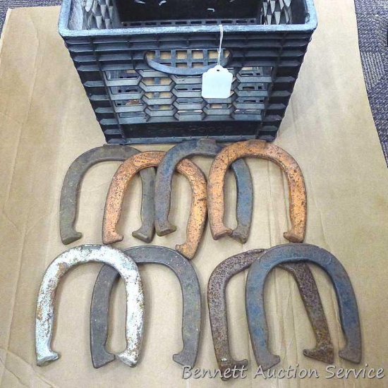 Eight throwing horseshoes are all around 7" x 7".