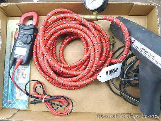 Sears timing light, Cen-Tech digital clamp meter, butane pencil torch, braided air hose with gauge.