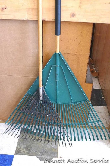 Two leaf lawn rakes, larger has a 30" head. Other has oil tempered stress relieved tines. Tall about