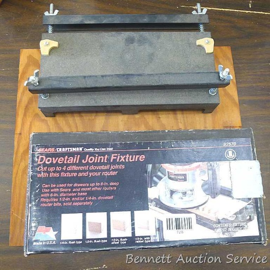 Craftsman dovetail joint fixture is mounted on a 15" x 13" board. Comes with box, plates, more.