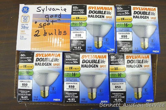 Four Sylvania double halogen spot light bulbs are 50W, a 60W replacement. Two are handwritten on "10