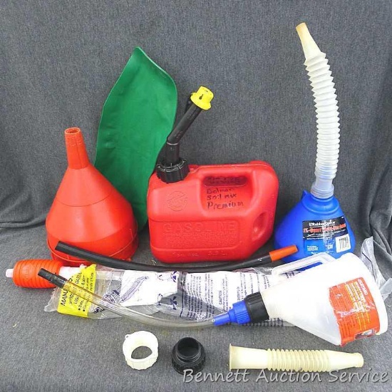 Funnels, siphoning tool, and a 1 gal 4 oz gasoline tote. Some funnels still have tags. Blue topped