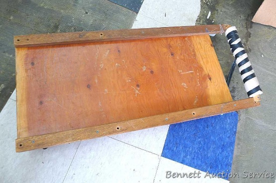 Mechanics creeper is about 16" x 36" with about 3" of ground clearance.