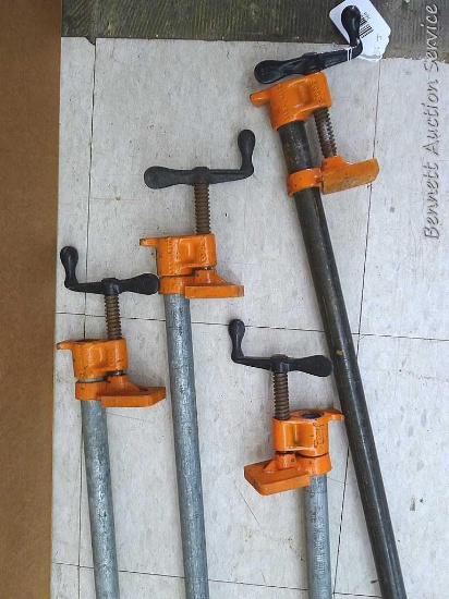 Four Pony brand pipe clamps up to about 4' long.