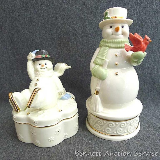 Two Lenox music boxes titled Winter Wonderland Music Box and Wonderland Wishes. Taller about 6-1/2",