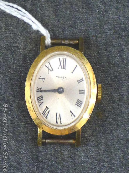 Timex wristwatch sets and runs. Measures about 15/16" x 1-1/4" long.