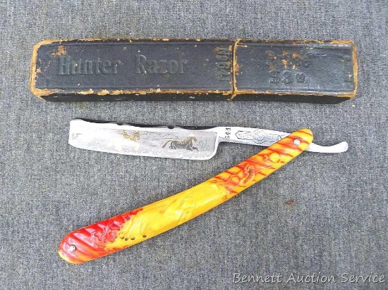 Fancy antique straight razor with a blade scene depicting cowboys chasing a wild horse. Tang is