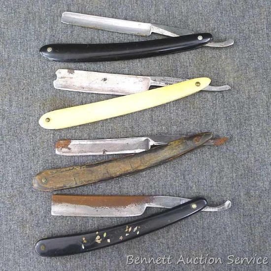 Four straight razors, one marked Wade & Butcher Sheffield England, Wooden handled razor marked No.