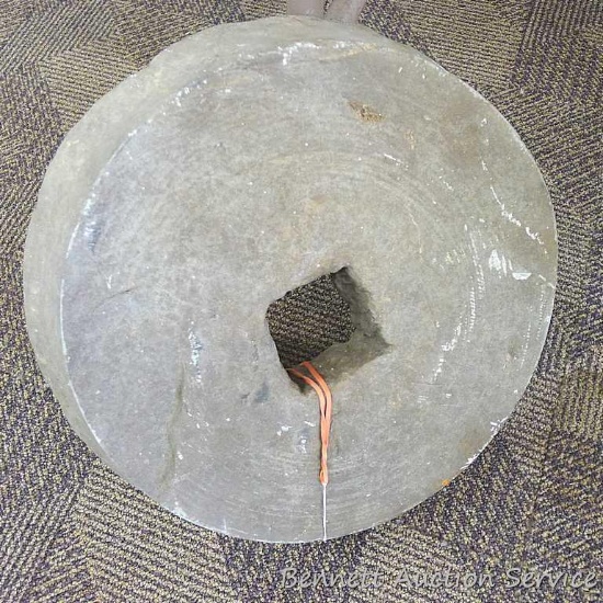 14" grinding stone wheel would make a neat stepping stone in your garden.
