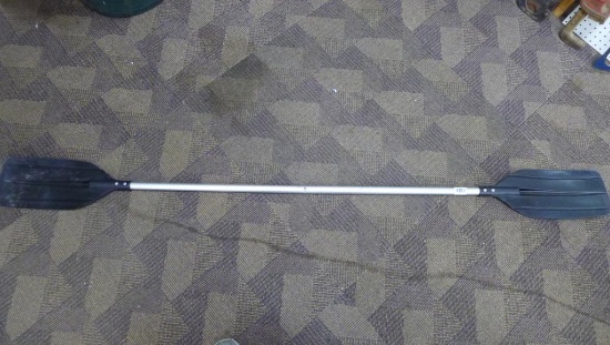 Kayak or canoe paddle can adjust to two positions, and comes apart for easy storage. Measures about