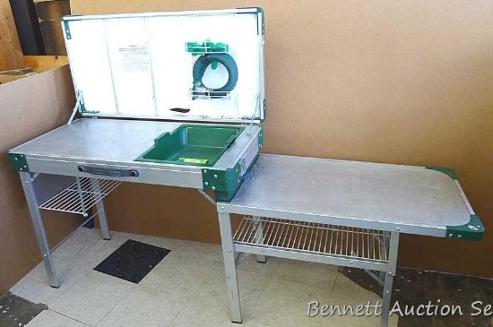 Coleman foldable camp kitchen opens to about 6' long. Main work table is about 20" wide and 29"