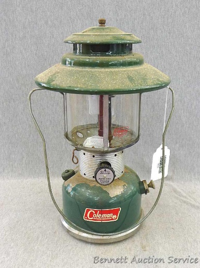 Coleman two mantel gas lantern model 228F. Lantern measures approx.. 14" x 10". Some paint chips