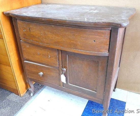 Cute little dresser with chamber pot door, has dovetailed drawers; measures 31-1/2" x 19" x 29-1/2"