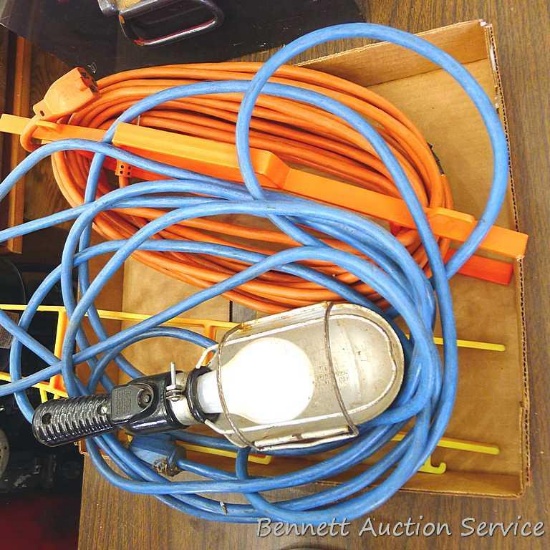 Extension cord and work light. Extension cord measures approx.. 50'. Part of the cord is taped. Work