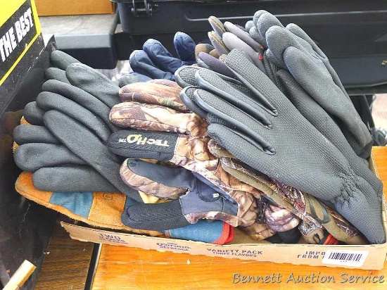 Large assortment of insulated hunting, winter, and working gloves. Gloves look to be in good