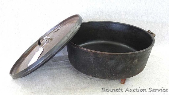 Cast Iron Dutch oven marked with a 12 and measures approx.. 13" x 6". Dutch oven just needs a good