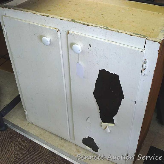 Vintage cupboard with two shelves. Cupboard measures approx.. 28" x 30" x 13" . Should restore