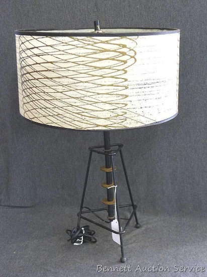 Unique table lamp which measures approx.. 16" x 23". Lamp lights up and would look great in your