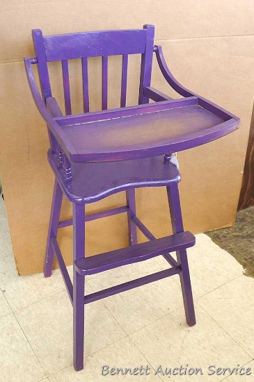 Sturdy wooden highchair with tray. Highchair measures approx.. 37" x 17" x 19". Some chips and