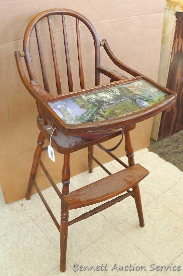 Cute wooden highchair with tray depicting Fred Smith Park photos and leather strap.