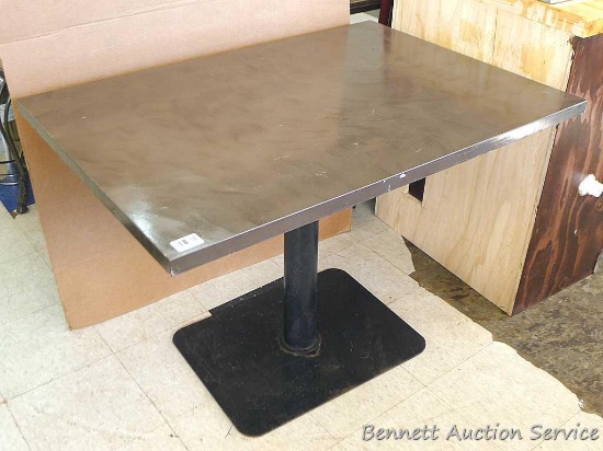 Sturdy pedestal table. Table measures approx.. 42" x 30" x 30" and looks to bin good condition.