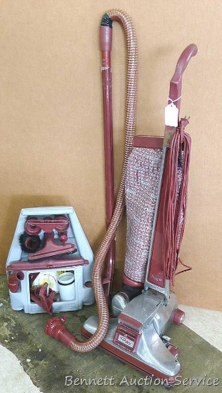 Kirby Legend II vacuum with many attachments. Vacuum is in good condition, has great suction, and